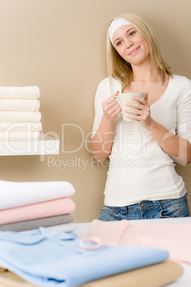 Laundry ironing - woman coffee break