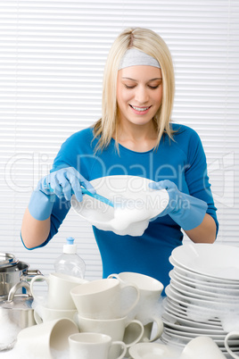 Modern kitchen - happy woman washing dishes