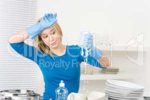 Modern kitchen - frustrated woman washing dishes