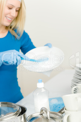 Modern kitchen - happy woman washing dishes