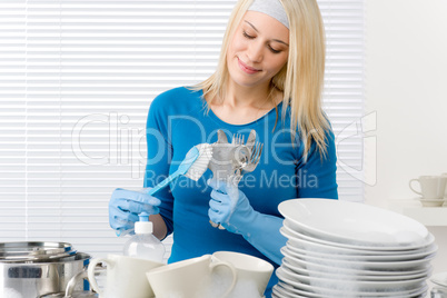 Modern kitchen - happy woman washing dishes