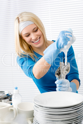 Modern kitchen - happy woman washing dishes