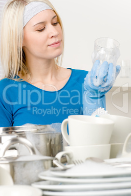 Modern kitchen - happy woman washing dishes