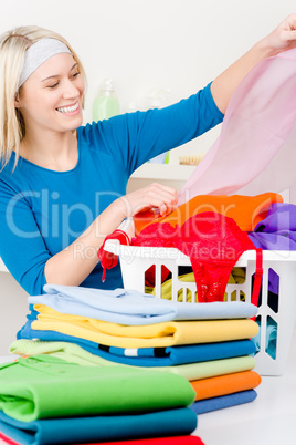 Laundry - woman folding clothes home