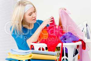 Laundry - woman folding clothes home