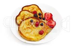 Three pancakes with berries