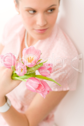 Fashion - young romantic woman with spring tulips