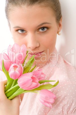 Fashion - young romantic woman with spring tulips