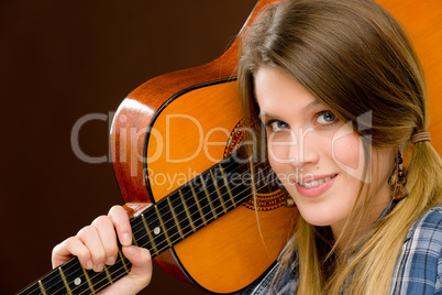 Rock musician - fashion woman holding guitar