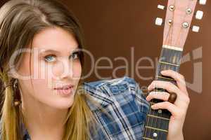 Rock musician - fashion woman holding guitar