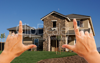 Female Hands Framing Beautiful House