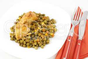 Chicken meat with green peas, carrots and corns on table