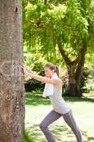 Woman doing her stretches in the park