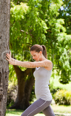 Woman doing her stretches in the park