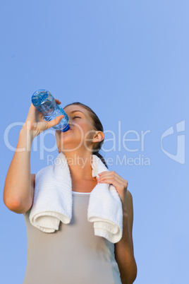 Young woman drinking water