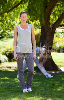 Couple doing their stretches in the park