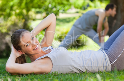 Couple doing their stretches in the park