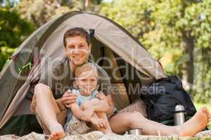 Father and his son camping