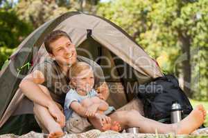 Father and his son camping