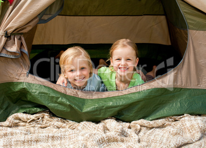 Happy family camping in the park