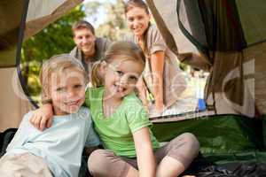 Happy family camping in the park