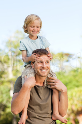 Father giving son a piggyback