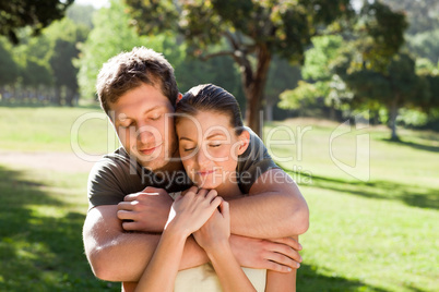 Man hugging his beautiful wife