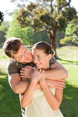 Man hugging his beautiful wife