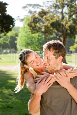 Woman hugging her handsome husband