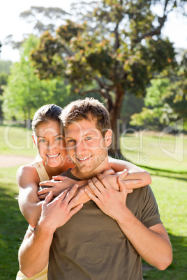 Woman hugging her handsome husband