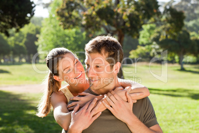 Woman hugging her handsome husband