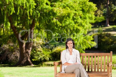 Brunette woman on the bench