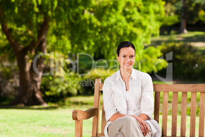 Brunette woman on the bench