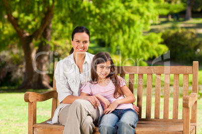 Mother and her daughter on the bench Mother and her daughter on the bench