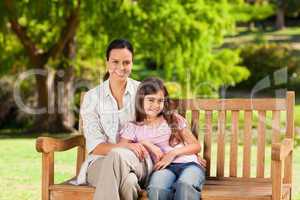 Mother and her daughter on the bench