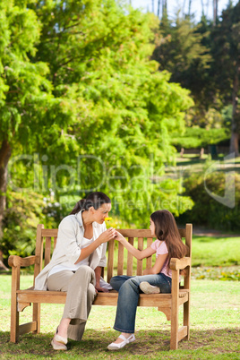 Cute girl with her mother in the park