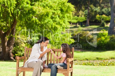 Cute girl with her mother in the park