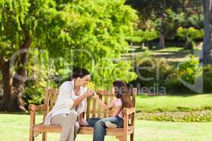 Cute girl with her mother in the park