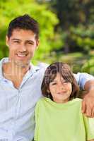 Son with his father on the bench