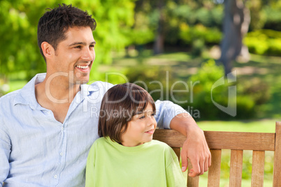 Son with his father on the bench