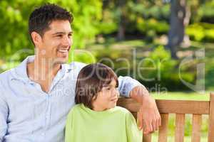 Son with his father on the bench