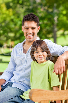 Son with his father on the bench