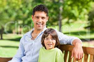 Son with his father on the bench