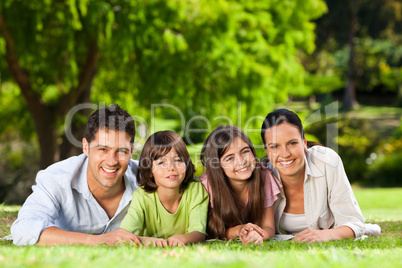 Family lying down in the park