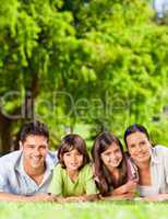 Family lying down in the park