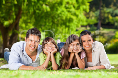 Family lying down in the park