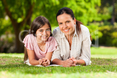 Mother with her daughter lying down