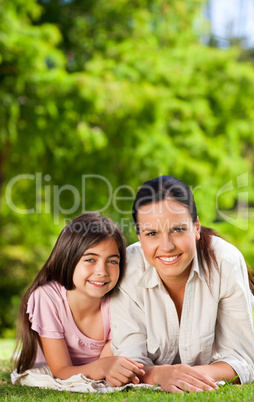 Mother with her daughter lying down