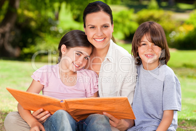 Family looking at their album photo