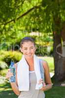 Woman drinking water after the gym